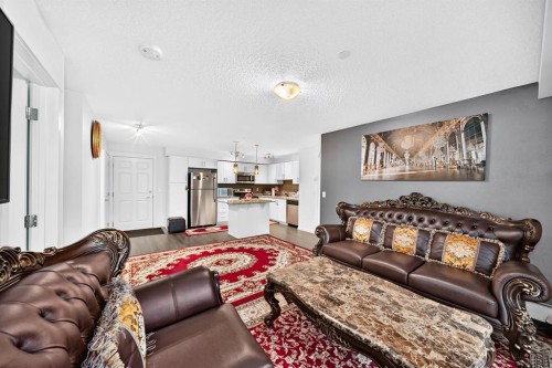 4310-755 Copperpond Boulevard Se, Calgary, AB - Indoor Photo Showing Living Room