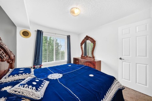 4310-755 Copperpond Boulevard Se, Calgary, AB - Indoor Photo Showing Bedroom