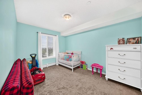 4310-755 Copperpond Boulevard Se, Calgary, AB - Indoor Photo Showing Bedroom