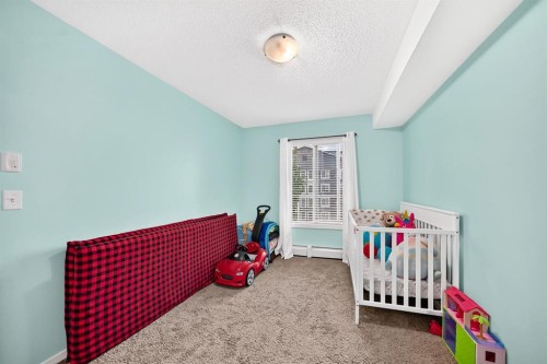 4310-755 Copperpond Boulevard Se, Calgary, AB - Indoor Photo Showing Bedroom