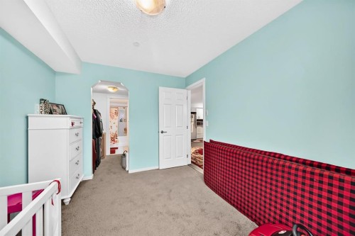 4310-755 Copperpond Boulevard Se, Calgary, AB - Indoor Photo Showing Bedroom