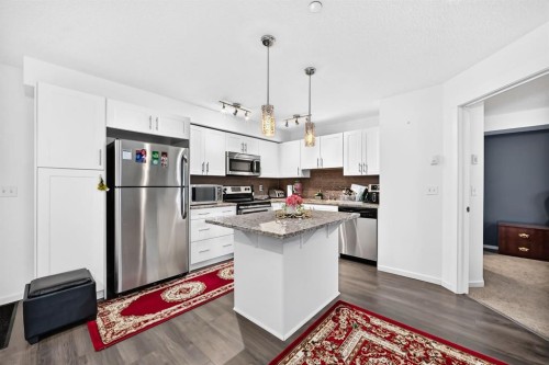 4310-755 Copperpond Boulevard Se, Calgary, AB - Indoor Photo Showing Kitchen With Upgraded Kitchen