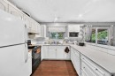 4940 Rundlewood Road Ne, Calgary, AB  - Indoor Photo Showing Kitchen With Double Sink 