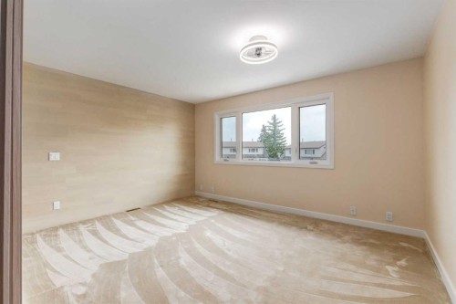 112-1190 Ranchview Road Nw, Calgary, AB - Indoor Photo Showing Other Room
