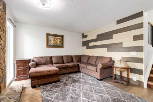 112-1190 Ranchview Road Nw, Calgary, AB - Indoor Photo Showing Living Room