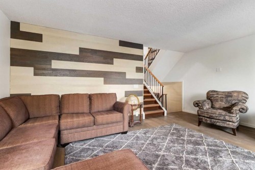 112-1190 Ranchview Road Nw, Calgary, AB - Indoor Photo Showing Living Room