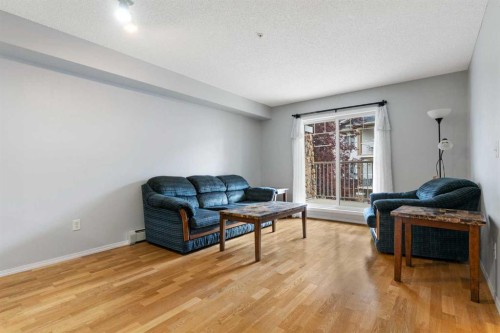 1102-70 Panamount Drive Nw, Calgary, AB - Indoor Photo Showing Living Room