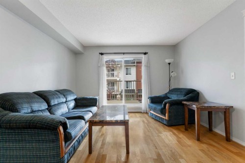 1102-70 Panamount Drive Nw, Calgary, AB - Indoor Photo Showing Living Room