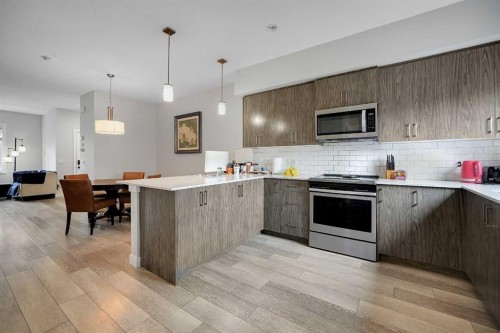 42 Midtown Boulevard Sw, Airdrie, AB - Indoor Photo Showing Kitchen With Upgraded Kitchen