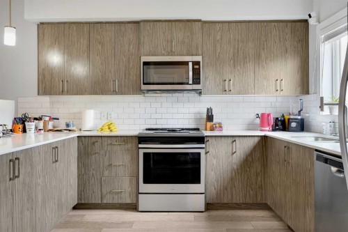 42 Midtown Boulevard Sw, Airdrie, AB - Indoor Photo Showing Kitchen With Upgraded Kitchen