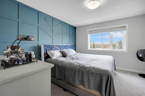 42 Midtown Boulevard Sw, Airdrie, AB - Indoor Photo Showing Bedroom
