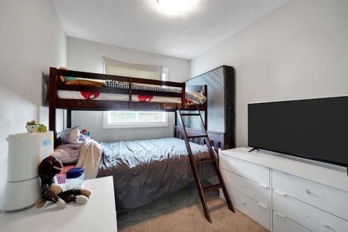 42 Midtown Boulevard Sw, Airdrie, AB - Indoor Photo Showing Bedroom