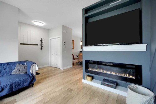 42 Midtown Boulevard Sw, Airdrie, AB - Indoor Photo Showing Other Room With Fireplace