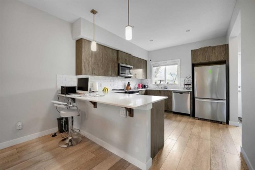 42 Midtown Boulevard Sw, Airdrie, AB - Indoor Photo Showing Kitchen With Upgraded Kitchen