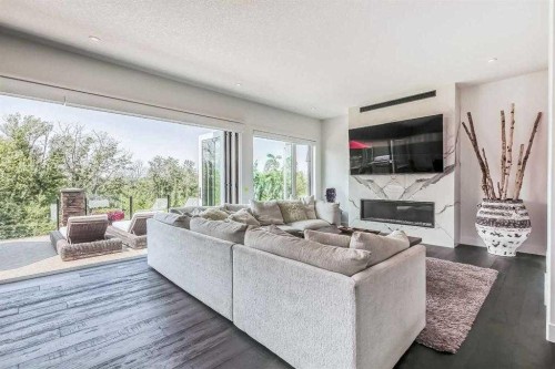 276 Cranbrook Point Se, Calgary, AB - Indoor Photo Showing Living Room With Fireplace