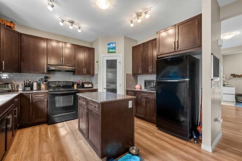 116 Drake Landing Loop, Okotoks, AB - Indoor Photo Showing Kitchen With Double Sink