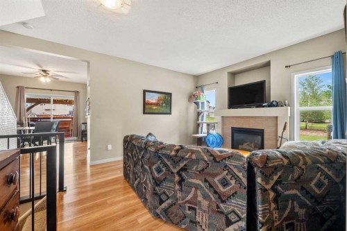 116 Drake Landing Loop, Okotoks, AB - Indoor Photo Showing Living Room With Fireplace