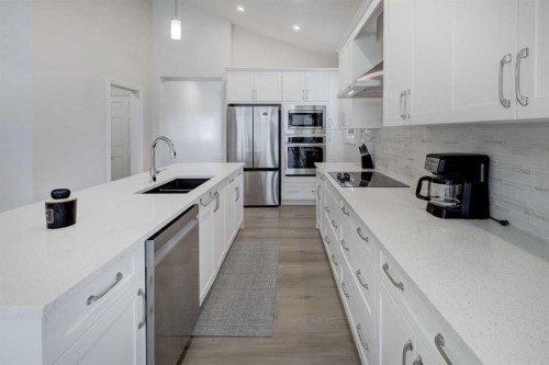 351 Baywater Common Sw, Airdrie, AB - Indoor Photo Showing Kitchen With Stainless Steel Kitchen With Double Sink With Upgraded Kitchen