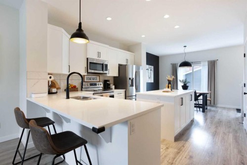 136 Highview Gate Se, Airdrie, AB - Indoor Photo Showing Kitchen With Double Sink With Upgraded Kitchen