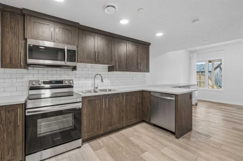215 Lucas Terrace Nw, Calgary, AB - Indoor Photo Showing Kitchen With Double Sink