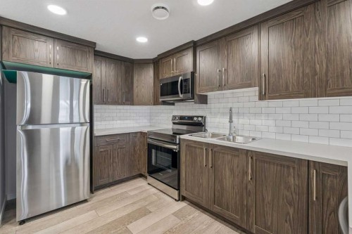 215 Lucas Terrace Nw, Calgary, AB - Indoor Photo Showing Kitchen With Stainless Steel Kitchen With Double Sink
