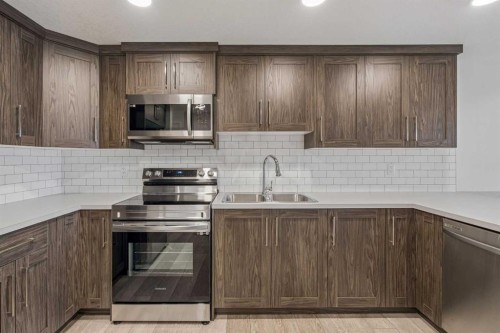 215 Lucas Terrace Nw, Calgary, AB - Indoor Photo Showing Kitchen With Stainless Steel Kitchen With Double Sink