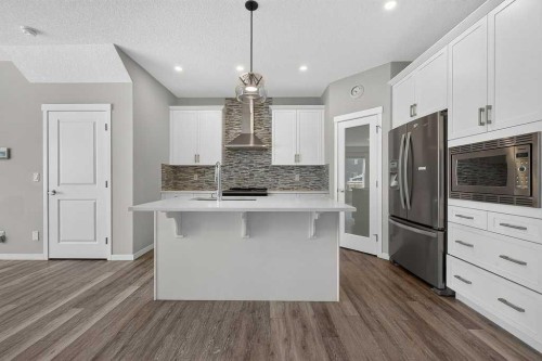 556 Belmont Heath Sw, Calgary, AB - Indoor Photo Showing Kitchen With Stainless Steel Kitchen With Upgraded Kitchen
