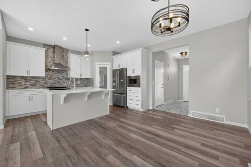 556 Belmont Heath Sw, Calgary, AB - Indoor Photo Showing Kitchen With Upgraded Kitchen
