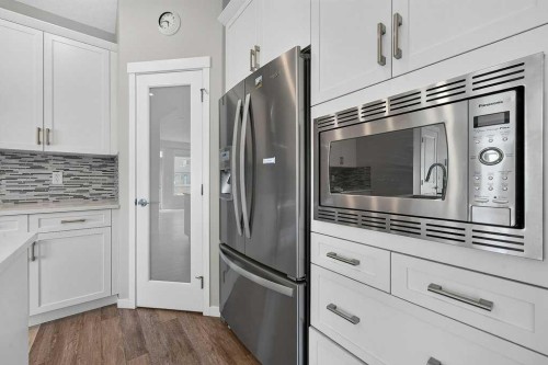 556 Belmont Heath Sw, Calgary, AB - Indoor Photo Showing Kitchen With Stainless Steel Kitchen