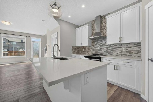 556 Belmont Heath Sw, Calgary, AB - Indoor Photo Showing Kitchen With Upgraded Kitchen