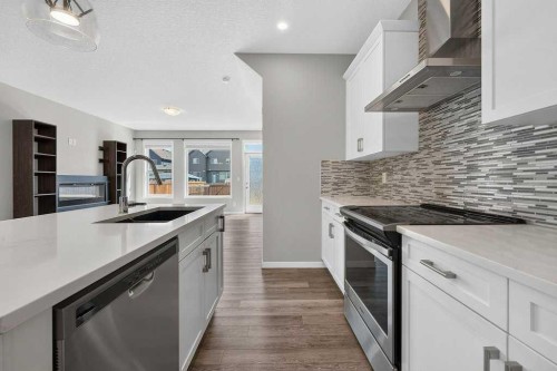 556 Belmont Heath Sw, Calgary, AB - Indoor Photo Showing Kitchen With Stainless Steel Kitchen With Upgraded Kitchen