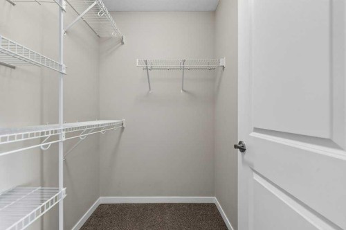 556 Belmont Heath Sw, Calgary, AB - Indoor With Storage