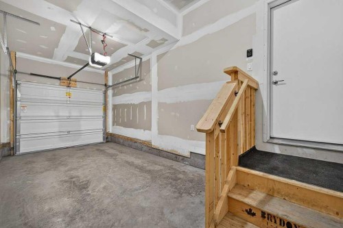 556 Belmont Heath Sw, Calgary, AB - Indoor Photo Showing Garage
