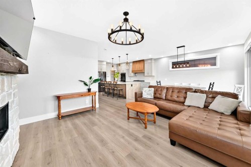 12 Willow Street, Cochrane, AB - Indoor Photo Showing Living Room With Fireplace