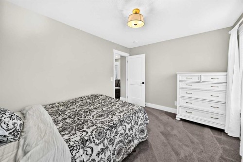 12 Willow Street, Cochrane, AB - Indoor Photo Showing Bedroom