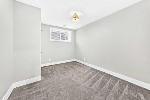 12 Willow Street, Cochrane, AB - Indoor Photo Showing Other Room