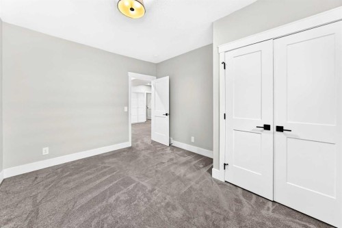 12 Willow Street, Cochrane, AB - Indoor Photo Showing Other Room