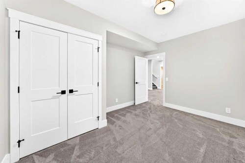 12 Willow Street, Cochrane, AB - Indoor Photo Showing Other Room