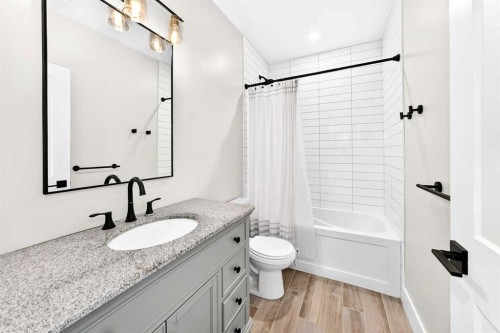 12 Willow Street, Cochrane, AB - Indoor Photo Showing Bathroom