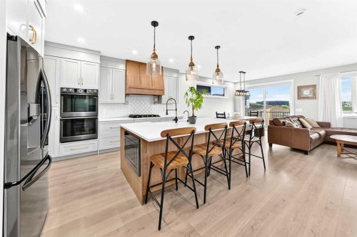 12 Willow Street, Cochrane, AB - Indoor Photo Showing Kitchen With Stainless Steel Kitchen With Upgraded Kitchen