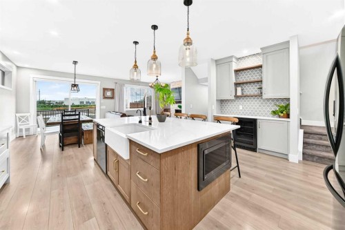 12 Willow Street, Cochrane, AB - Indoor Photo Showing Kitchen With Upgraded Kitchen