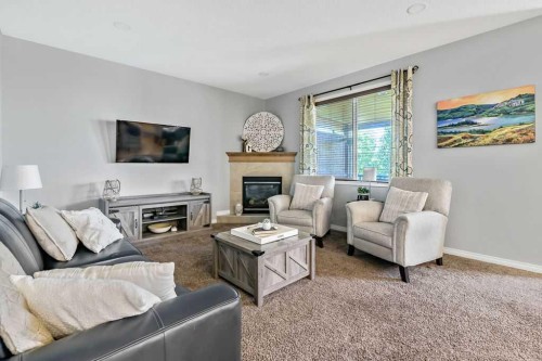 1034 Ranch Road, Okotoks, AB - Indoor Photo Showing Living Room With Fireplace