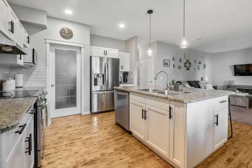 1034 Ranch Road, Okotoks, AB - Indoor Photo Showing Kitchen With Stainless Steel Kitchen With Double Sink With Upgraded Kitchen