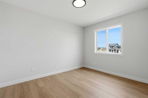 695 Buffaloberry Manor Se, Calgary, AB - Indoor Photo Showing Other Room