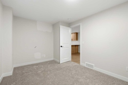 695 Buffaloberry Manor Se, Calgary, AB - Indoor Photo Showing Other Room