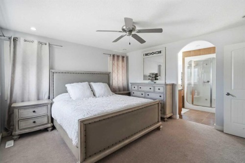 100 Cove Rise, Chestermere, AB - Indoor Photo Showing Bedroom