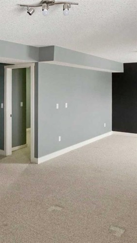 100 Cove Rise, Chestermere, AB - Indoor Photo Showing Other Room