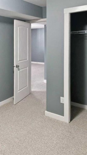 100 Cove Rise, Chestermere, AB - Indoor Photo Showing Other Room
