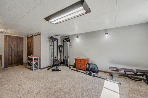 677 Wallace Drive, Carstairs, AB - Indoor Photo Showing Gym Room