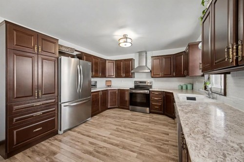 677 Wallace Drive, Carstairs, AB - Indoor Photo Showing Kitchen With Stainless Steel Kitchen